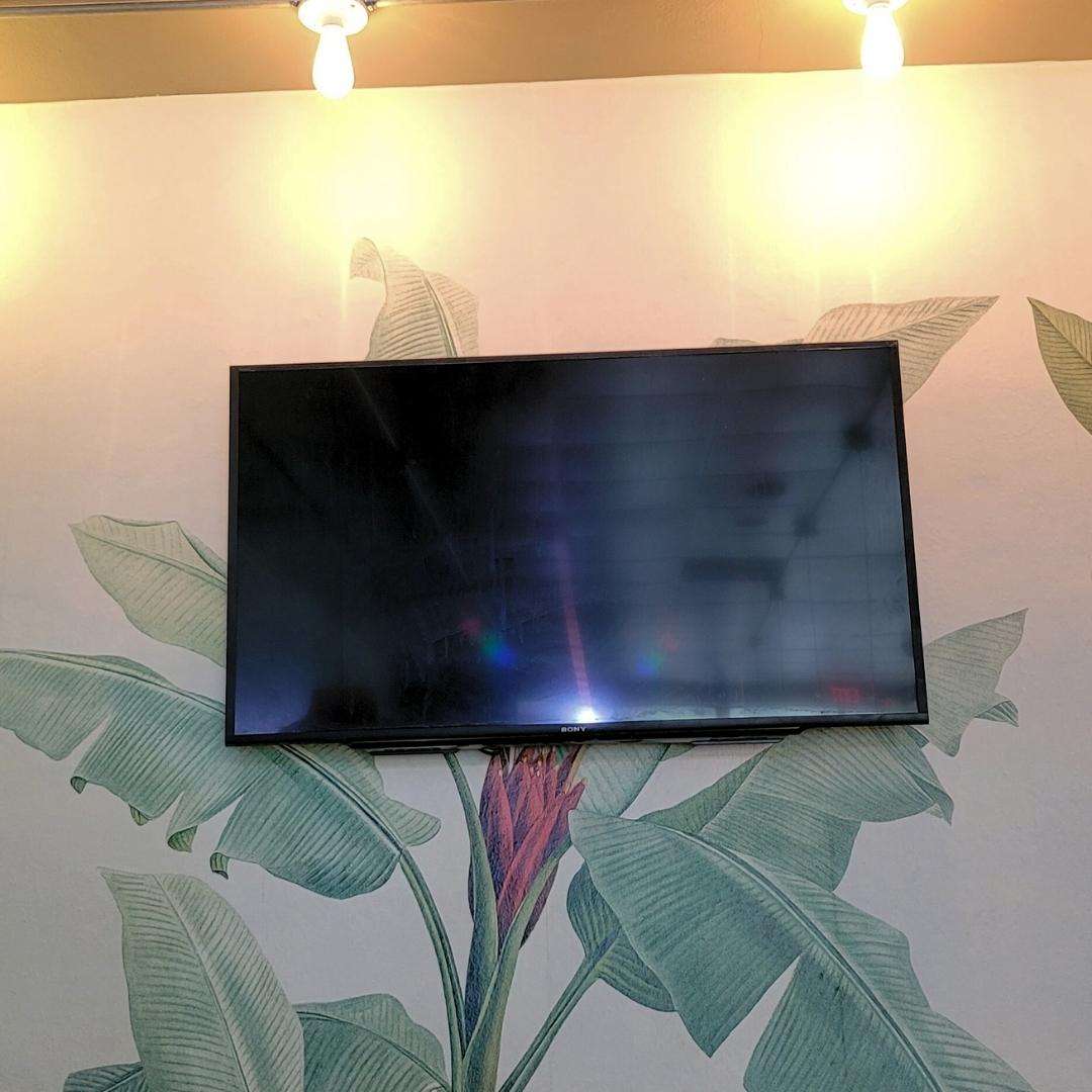 TV installed on the wall in caffee