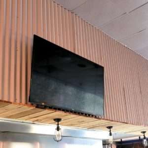 TV installed on the wall in caffee